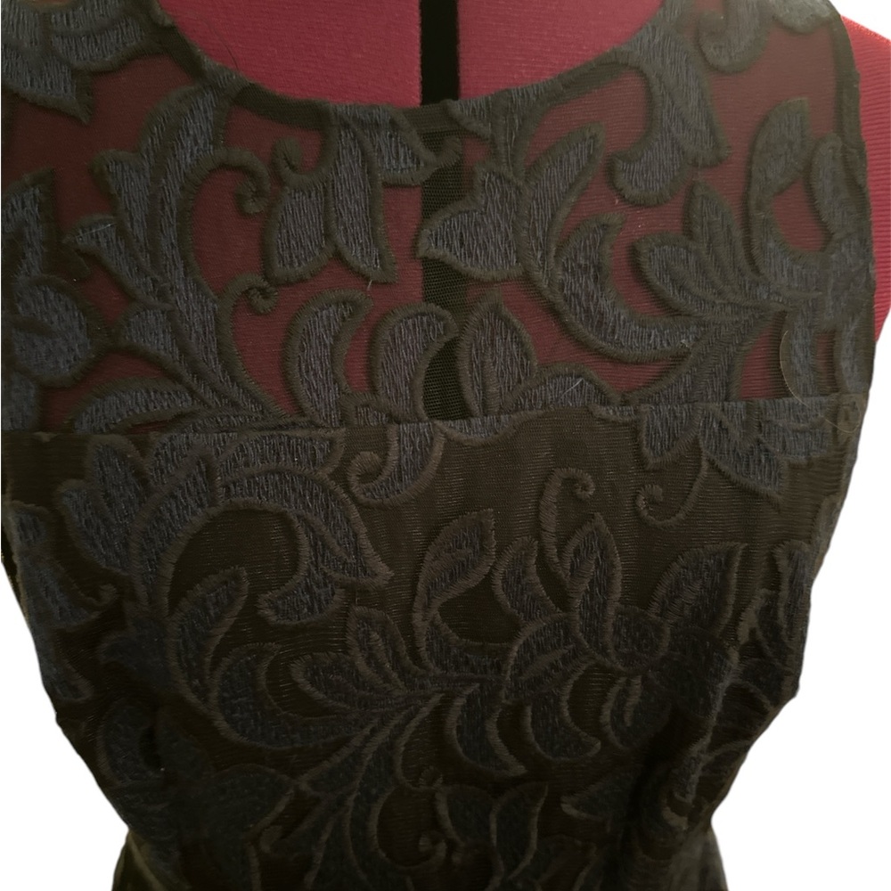 Navy sleeveless dress by Donna Morgan size 8. Top is partially sheer.